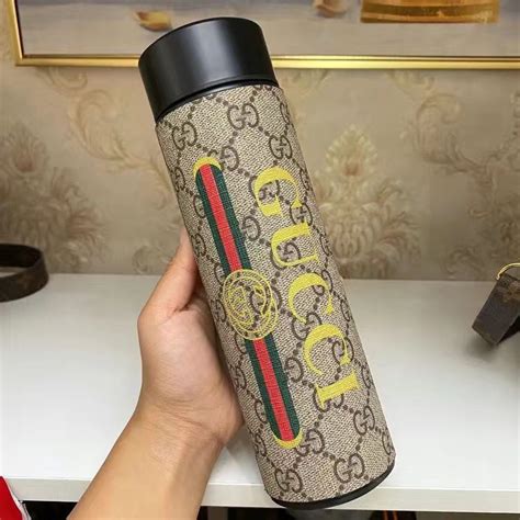 is the top of a gucci bottle made of plastic|Gucci water bottles.